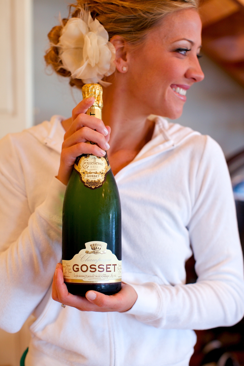   The bride with her namesake champagne, which she received as a birthday gift and saved for a special occasion  
